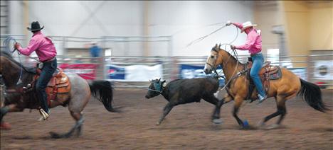 Trevar McAllister spurs his bareback horse at the Montana High School Rodeo Finals in Kalispell.