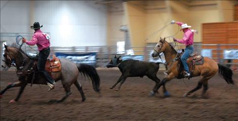 Wyatt Lytton heels a steer for partner Carson King. Lytton and King advanced to the National High School Finals.