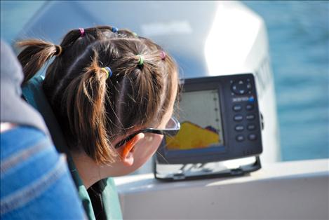 Breanna Reinsberg watches a fish, aka “the black blob,” on the fish finder.  