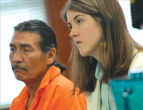 Harry Lozeau, left, and attorney Ashley Morigeau listen as Judge Deborah Kim Christopher transfers Lozeau’s case to Judge Jim Manley’s court.