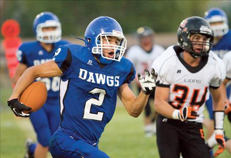 Mission’s Raymond Matt takes the ball downfield against the Eureka Lions Friday night. 