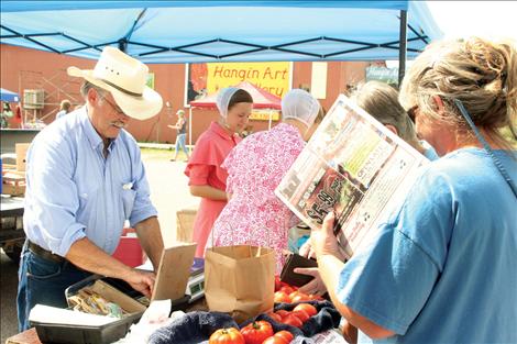 David Wolverton brought his early tomato yield to the market and went home early after selling out.