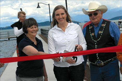 Former Polson Mayor Pat DeVries, Mayor Heather Knutson and CSKT Chair Ron Trahan cut the ribbon.