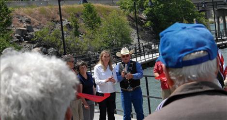 Former Polson Mayor Pat DeVries, Mayor Heather Knutson and CSKT Chair Ron Trahan cut the ribbon.