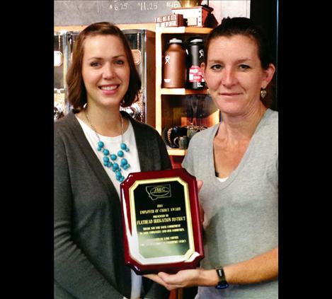 Job Service Employer Committee Chair Whitney Cantlon, left, presents the award to Johanna Clark of the Flathead Irrigation District.