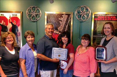 Job Service Employer Committee Chair Whitney Cantlon presents the award to the crew at Polson Theatres, Inc.