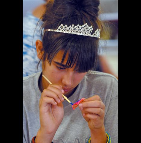 Rozlynn Blumel paints a bowtie pasta.