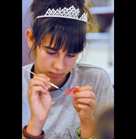 Rozlynn Blumel paints a bowtie pasta.