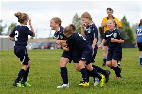 After Kallie Finkbeiner scores a goal, she gets a congratulatory hug from Sophia Moderie alongside teammates Tia Mercer, Jazlyn Dalbey and Grace Simonich.