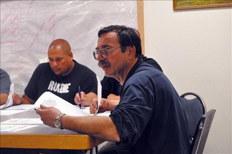 Mayor Kim Aipperspach looks at a police chief application. 