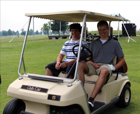 Mathew McGuyer and Luke Visnic enjoy their round of golf.