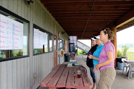 Members of the St. Luke Community Hospital Women’s Golf Team react to results from the The Sagmiller/Williams ALS Memorial Golf Tournament, which raises funds to help families impacted by the ALS disease. 