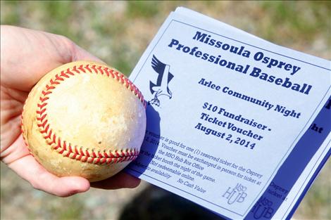 Anna Baldwin is selling tickets to an Osprey game to raise money for local softball and baseball teams.