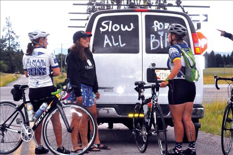 Riders meet up with the support van outside of Ronan. 