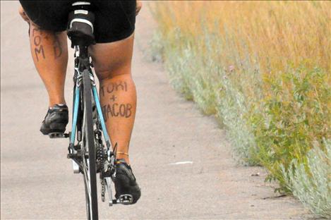 Calf art tells who the riders are pedaling for.