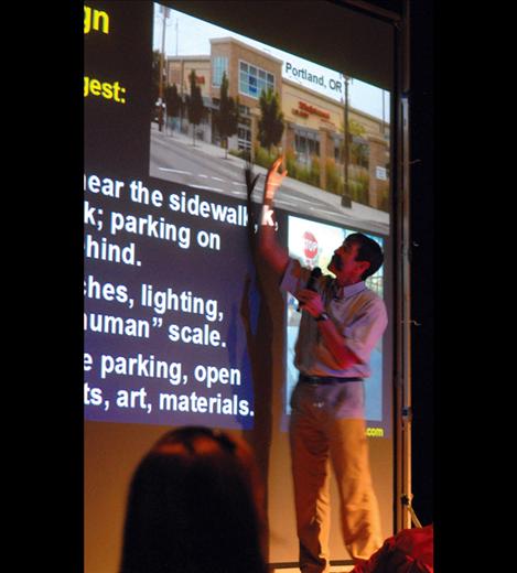 Mark Fenton goes through his presentation, talking about more walking, more biking, public transit and linking the three. 