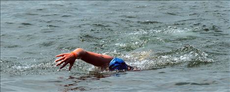 A swimmer begins another stroke.