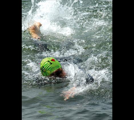 Swimmers cross the bay toward Boettcher Park.