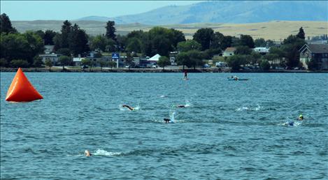 Swimmers cross the bay toward Boettcher Park.