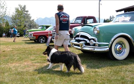 Visitors stroll though the car show Saturday in Ronan.