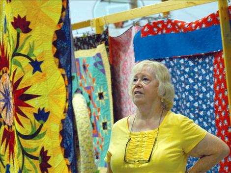 LaVon Grandy checks out a quilt at the Mission Mountain Quilt Guild Quilt show. Grandy also entered  a quilt and a wallhanging.
