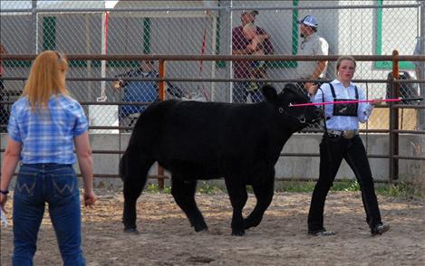 Virginia Kneer checks Laurel Rigby's calf.