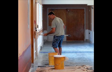 Painters work in the Polson Health and Rehabilitation Center as one step in the renovation of the facility.