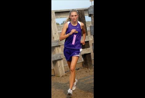 Amanda Stobie, who keeps  getting stronger according to coach Matt Seeley, makes her way down the calf chute and then to the  final sprint to the finish line at Saturday’s Polson Invitation Duels.