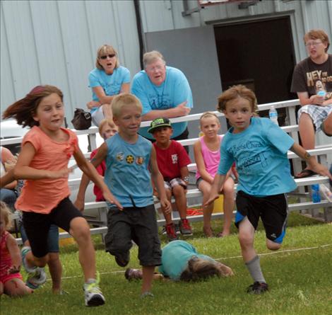 Kids compete in a foot race at the fair.