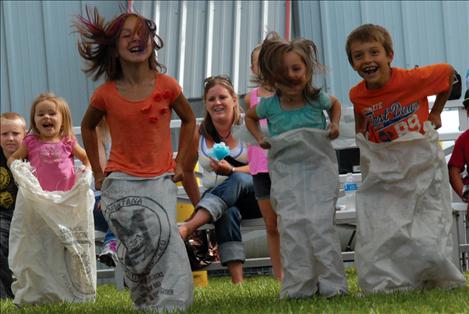 A sack race at the fair brought on some giggly good fun.