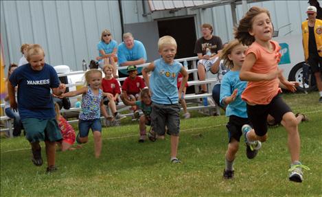 Children in a foot race at the fair.