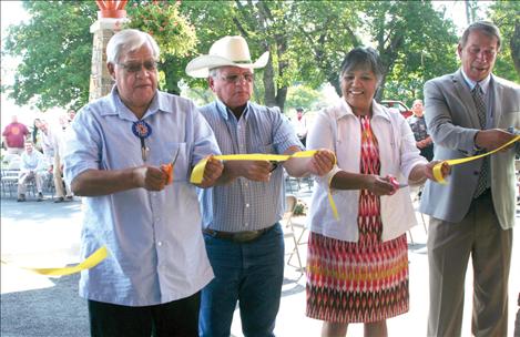 A ribbon cutting ceremony re-opens clinic. From left are Tony Incashola of the culture committee, Ron Trahan and Patty Stevens from the Tribal Council and Kevin Howlett, Tribal Health director.