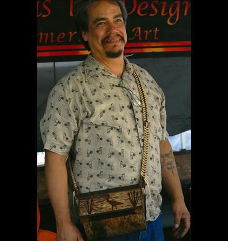 ion Alberts wears a traditional berry basket he made, mostly from birch bark. 