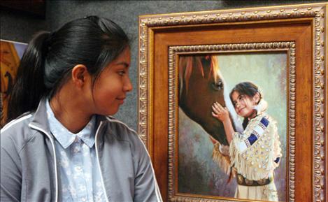 Denika Edmo, 11, remembers enjoying riding the horse she posed with for the painting when she was a small child.