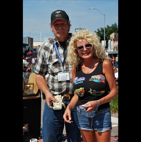 Nila Anderson of Anderson Broadcasting stands with raffle winner Jarren Brenner.