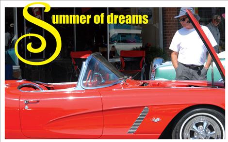 A red Chevy Corvette draws the admiration of a passerby during the Summerfest car show held last weekend in downtown Polson.