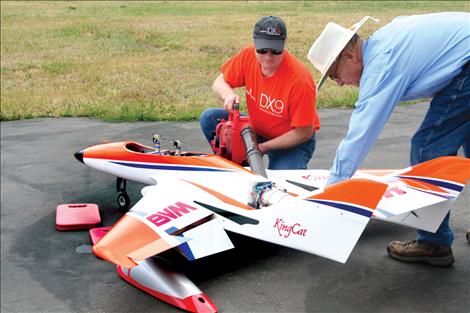 Ad Clark, right, cools off his turbo jet engine with the help of a pit crew.