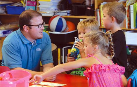 Brent Benkelman visits with kindergartners after recess at Cherry Valley.