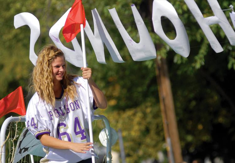 Keleigh Borchers rides on the sophomore float that also promised to pound the hounds, the Whitefish Bulldogs.