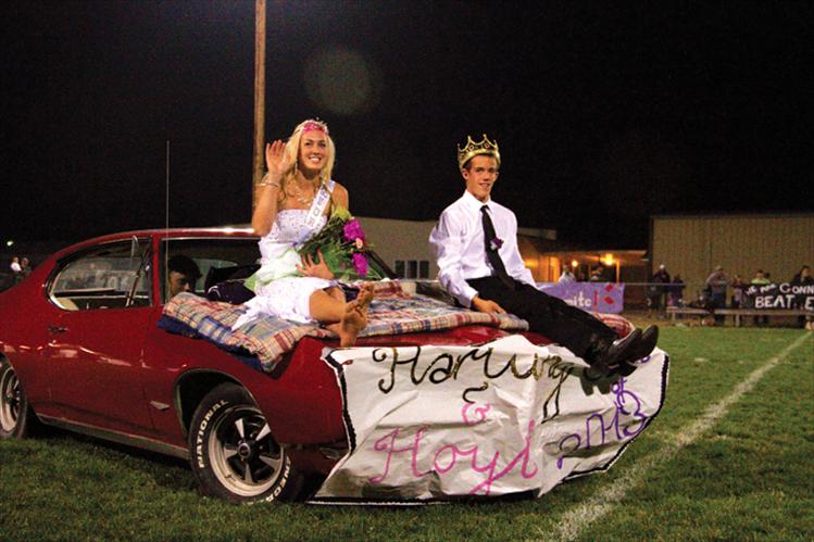  Rachel Hoyt and Travis Hartung ride away Firday night after being crowned homecoming queen and king.