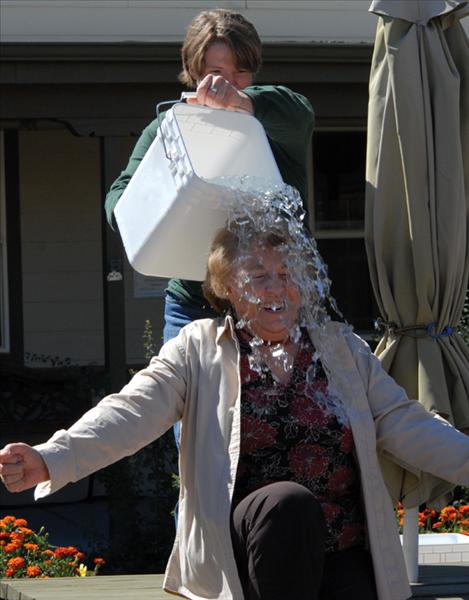 Billie Lee, director of Lake County Community Development, gasps as she is iced down. Lee challenged other food and ag centers around the state, Mark DeWitt and Ann Booth. 