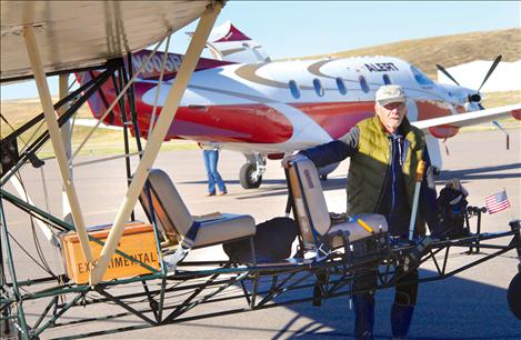 “Breezy” Bob Alm arrives at Polson Airport Saturday morning for the Fly-In, bundled up in layers of down. 