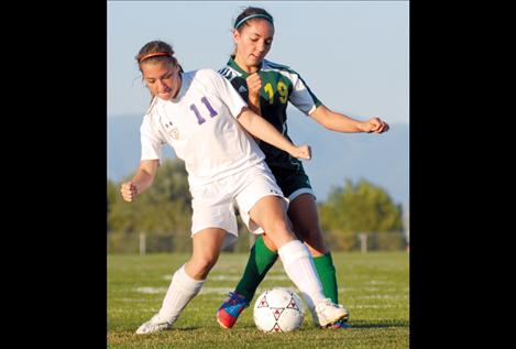 Lady Pirate Melina Jore avoids Whitefish defender Ceara Lawshe during a home game last week.