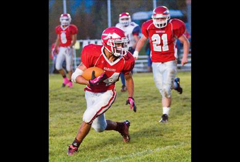 Followed by senior linebacker Lane Wilson, senior running back Christian Haynes weaves his way down the field against Superior.