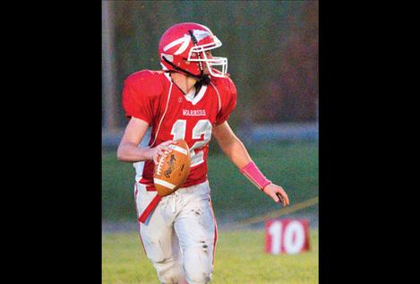 Sophomore quarterback Riley Rogers looks for a receiver during Friday night’s game.