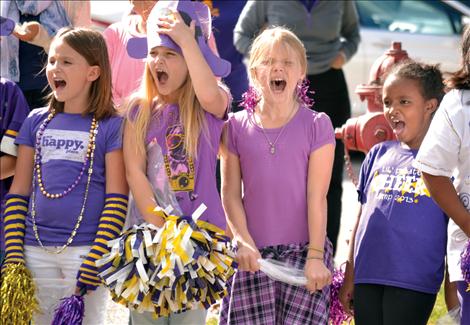 Polson streets are lined in purple and gold for Friday’s Polson homecoming parade, where Linderman Elementary School students scream “Polson Pirates” as they wait for the parade to rolll by.