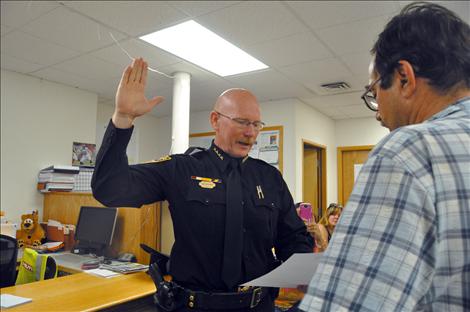 Ken Weaver is sworn in as Ronan police chief by Mayor Kim Aipperspach. 