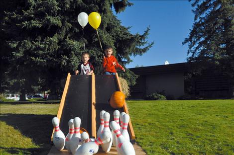 Aiden and Austin Schall bowl with pumpkins. 