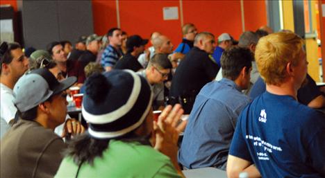 More than 100 dads listen as Tim Finkbeiner tells about the Dads of Great Students program.