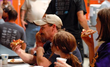 Stevie, Joe, Ana and Roxy Lattea enjoy pizza at Dads and Kids Pizza Night on Sept. 16.